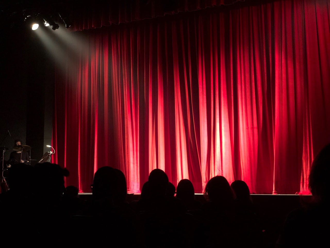 A lowered curtain in a theater.
