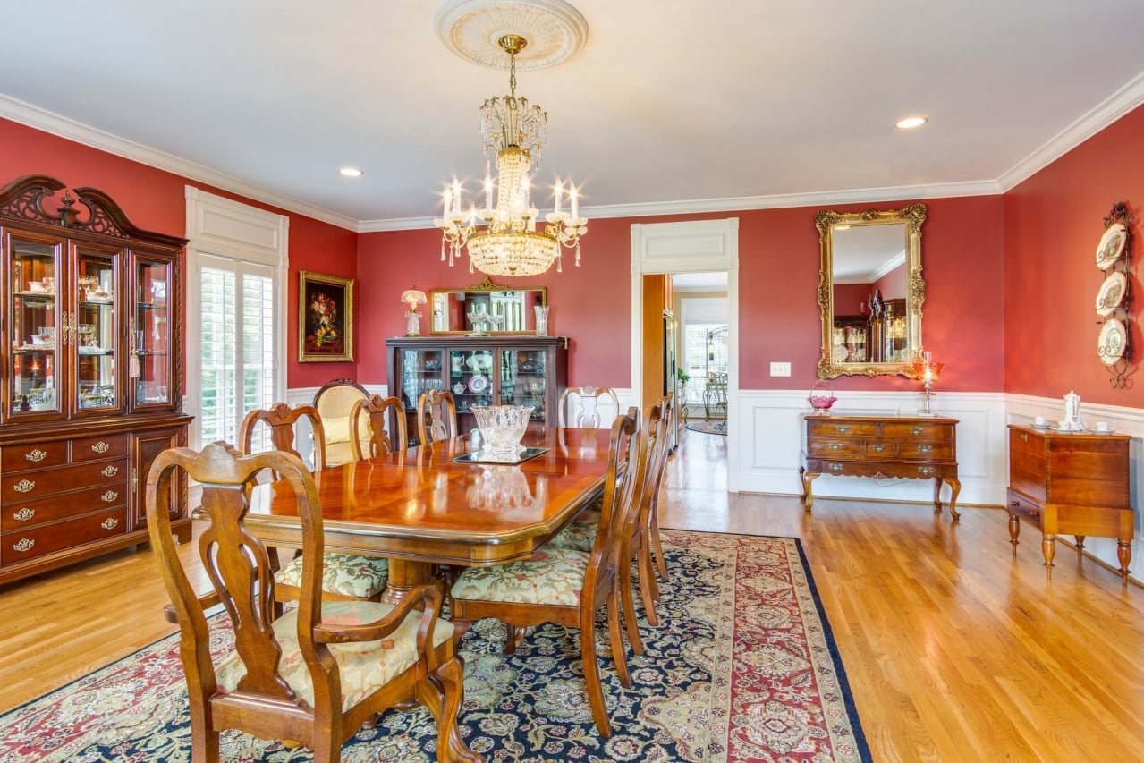 Formal dining room with elegant wood furniture.