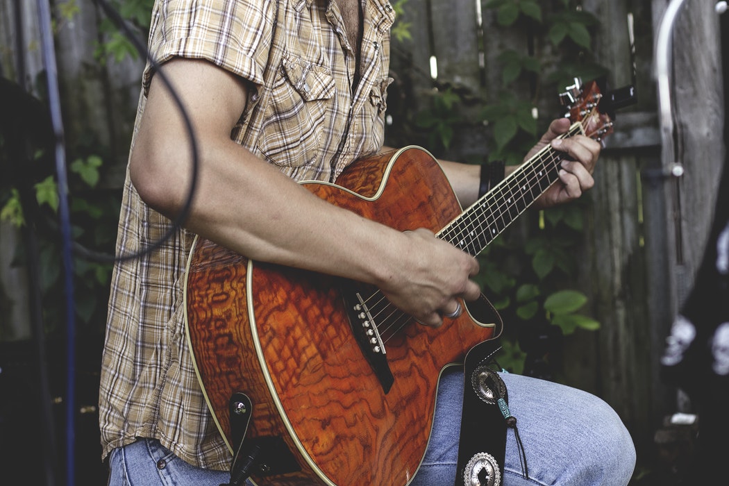 A person playing guitar.