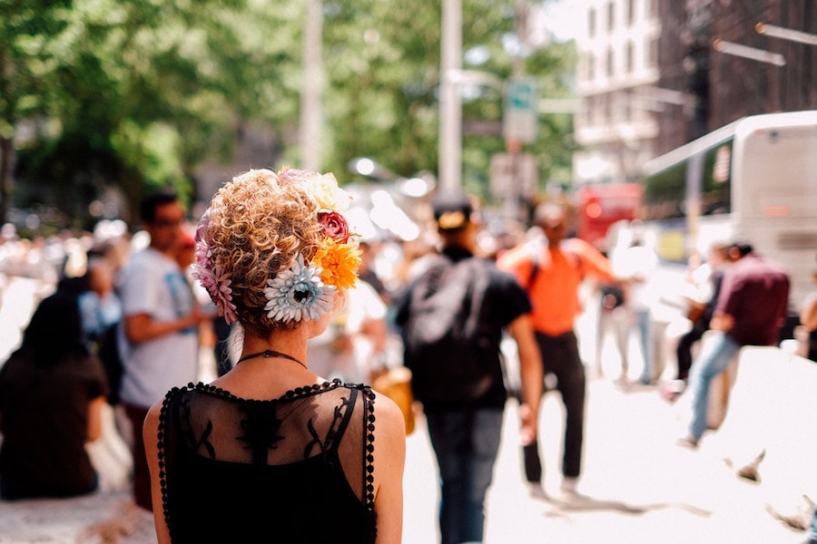 A woman walking down a city street. 