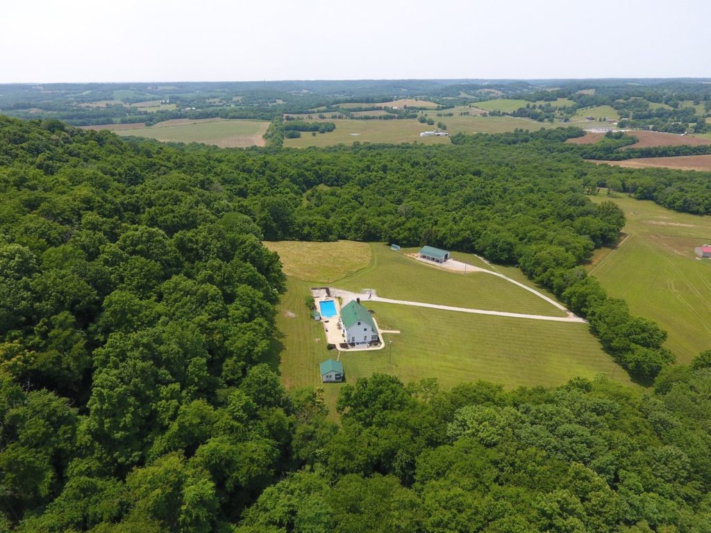 aerial view of house and barn