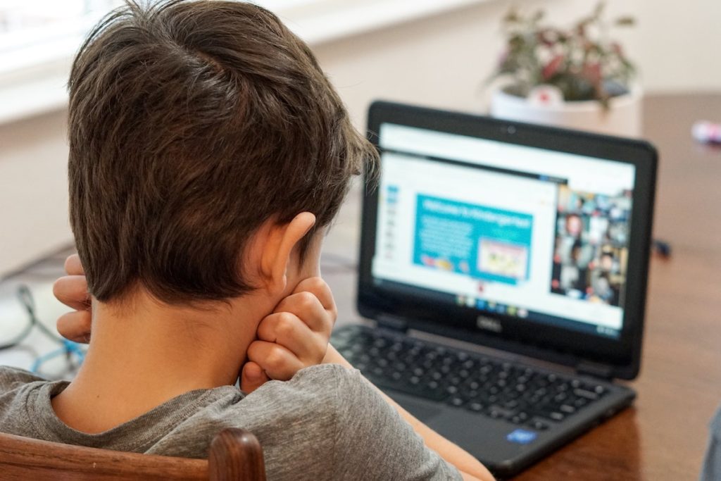 Student using a laptop during back to school season